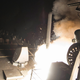 In this image provided by the U.S. Navy, the USS Ross (DDG 71) fires a tomahawk land attack missile Friday, April 7, 2017, from the Mediterranean Sea. The United States blasted a Syrian air base with a barrage of cruise missiles in fiery retaliation for this week’s gruesome chemical weapons attack against civilians. (Mass Communication Specialist 3rd Class Robert S. Price/U.S. Navy via AP)